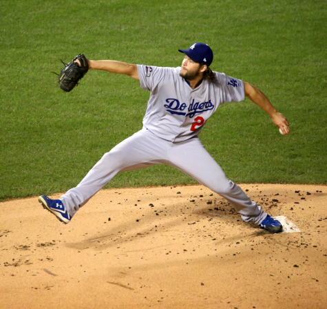 Going through his signature wind-up, pitcher Clayton Kershaw gets ready to deliver a pitch. Kershaw was finally able to win his first championship after a long history of postseason disappointment during his time with the Dodgers.