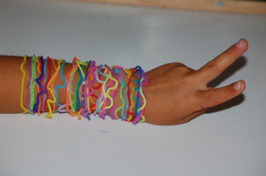 A student shows off an assortment of Silly Bandz on their wrist which became very popular among Gen Z children in the 2010s. Silly Bandz are no longer sold, becoming obsolete after being banned by most elementary schools for causing too much distraction among students.
