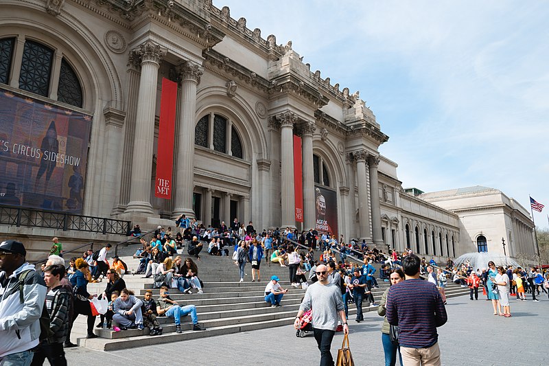 People gather during their day-to-day life on the esteemed Met steps. The Met Gala is held at the Metropolitan Museum of Art in New York. 
