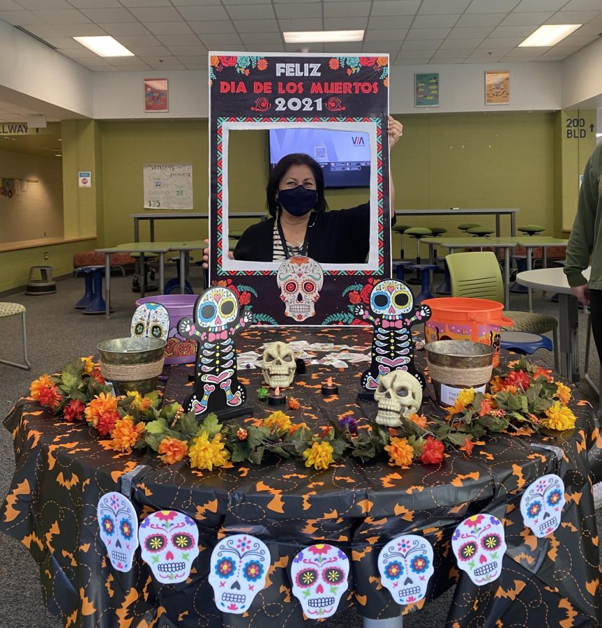 Holding up a Dia de los Muertos (Day of the Dead) frame, Señora Hernandez stands at a table in the senior lounge for students to come get candy during all three lunches. Celebrated on November 1st and 2nd, Dia de los Muertos is an annual holiday, recognized in Mexican culture to remember family members who have passed away. 