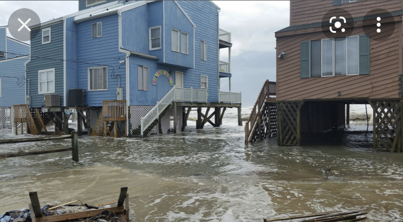 Outer Banks homes were flooded through, along with cars and personal belongings. Residents walk through floodwaters, where their homes used to sit on dry land.
