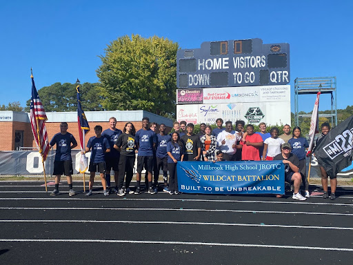 Caption: Gathered together, the Millbrook JROTC Wildcat Battalion stands together for a group picture at the Mission 22 fundraising event. After their 22-hour nonstop relay run, JROTC students take pride in raising over $4k for an organization that helps Veterans get back on their feet.  