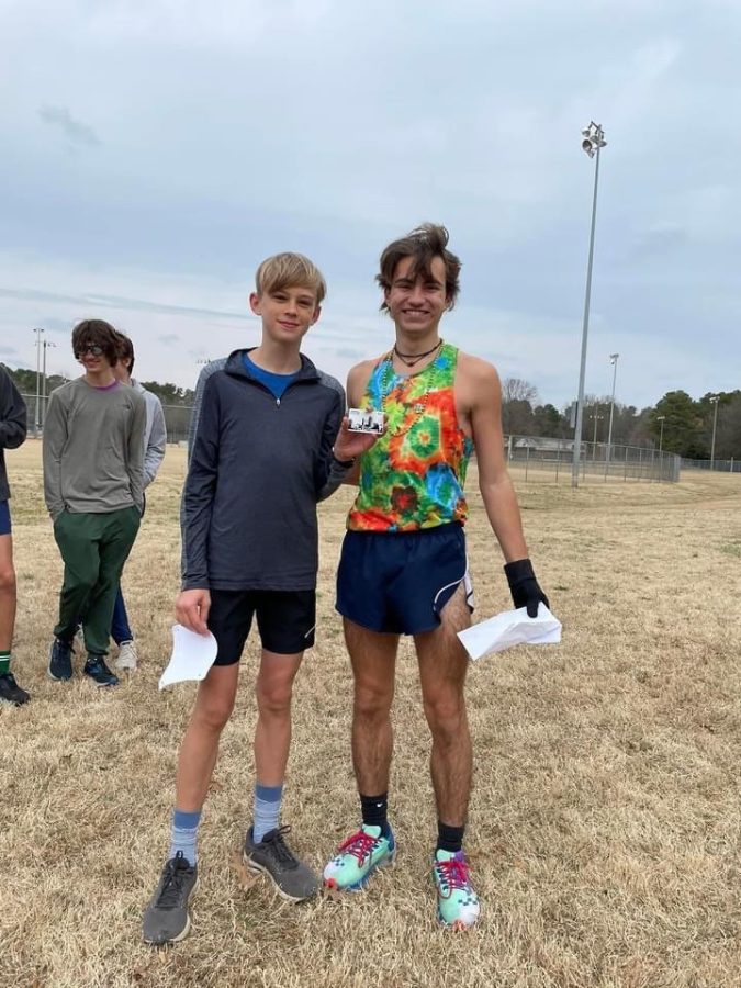 Silas Mann and the top male finisher. Fleet Feet sponsored awards for the top three male and female finishers and five extra gift cards for other participants.