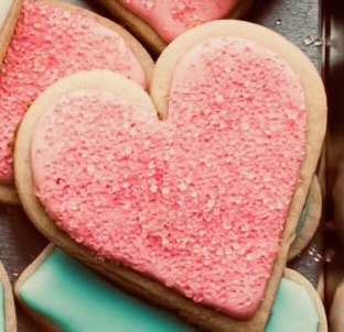 Here is a heart-shaped sugar cookie decorated with pink icing and sprinkles to show the Valentine’s day spirit. Friends and family would find these cookies delicious!