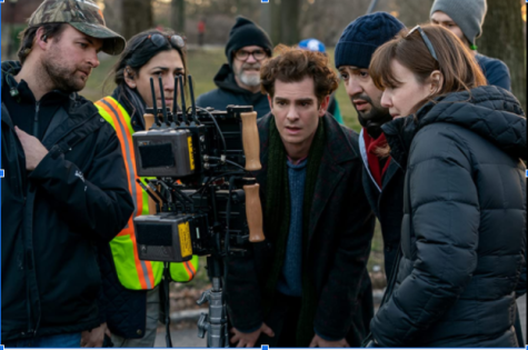 Andrew Garfield looking into the camera, along with Lin-Manuel Miranda and the rest of the crew. The crew together analyzes a scene and looks for improvement.
