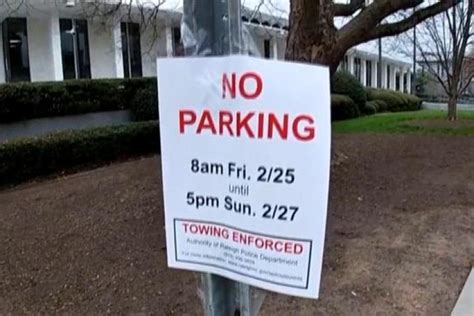 Raleigh police forces put up “No Parking” signs on streets around the North Carolina Legislative Building. The parking ban is from 8 a.m. on Friday until 5 p.m. on Sunday.
