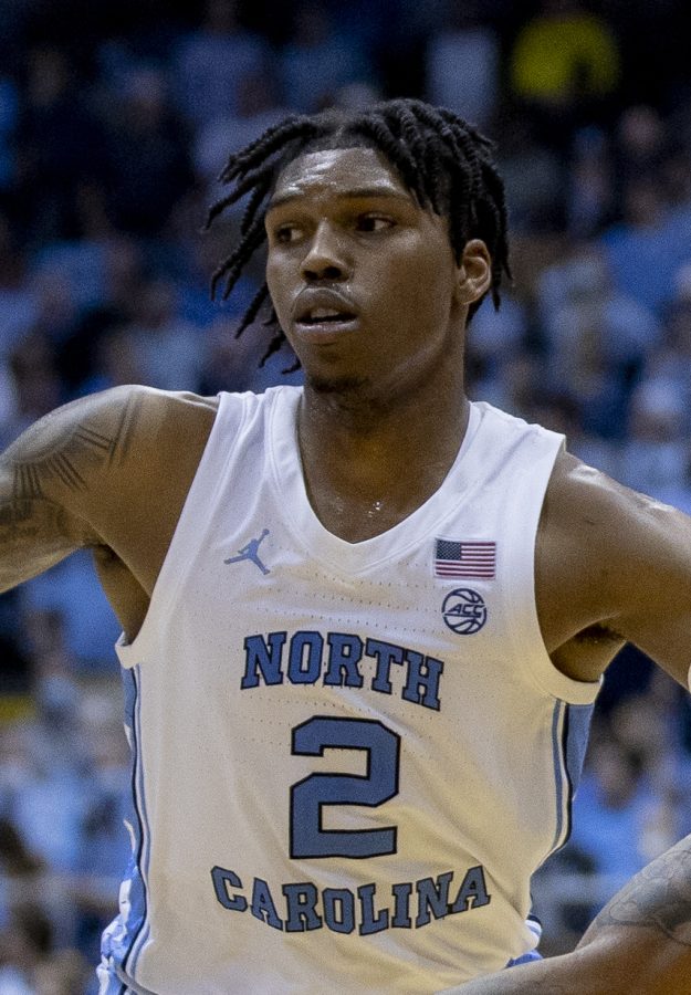UNC+Chapel+Hill+Basketball+player+Caleb+Love+jumps+to+shoot+a+3-pointer.+During+the+March+Madness+championship+game%2C+Love+scored+thirteen+points+for+his+team.%0A