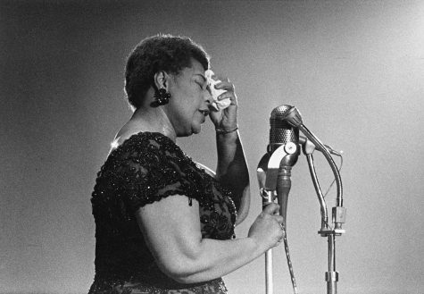 Ella Fitzgerald is seen performing in Amsterdam, in 1961, in a shimmering black gown. Her soft and elegant vocals continue to capture the interest of jazz fans throughout the years.