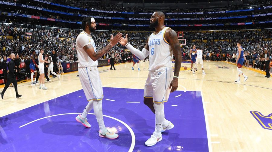 LeBron James giving Anthony Davis a handshake after their First win of the season.