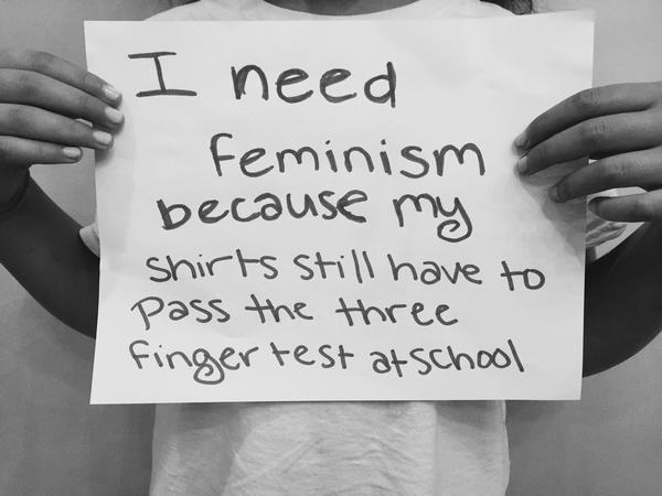 “Ariela Basson, an author holds a sign about feminism and school dress codes. (Provided by: Jewish Women’s Archive)”