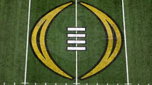 College Football Playoffs logo printed on the field in Atlanta for the semi-finals/championship.