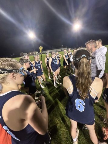 Coach Cope preparing the girls during a timeout at their most recent game 