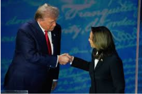 Donald Trump and Kamala Harris shaking hands. This is their first interaction. 