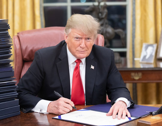 Donald J. Trump signing one of his fifty-four executive orders since being back in office.