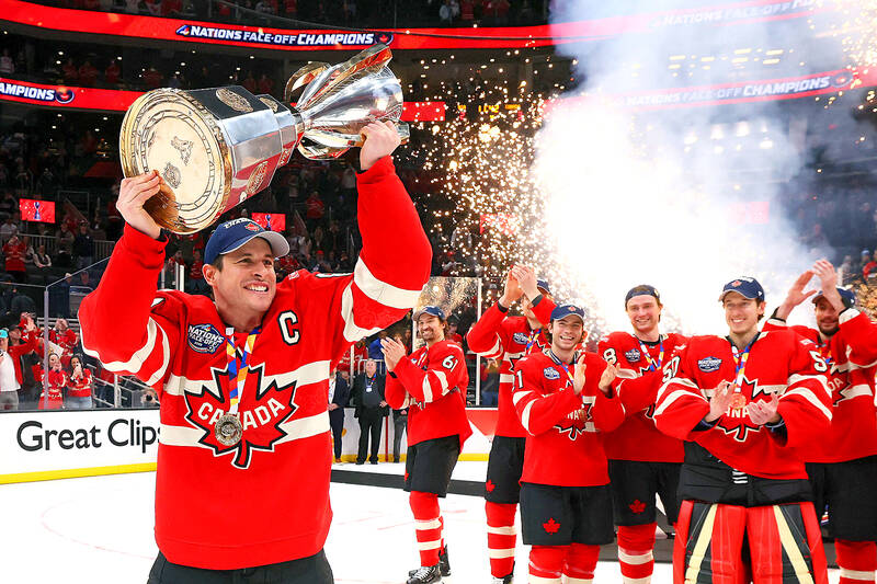 Canada’s captain Sidney Crosby holding the Four Nations Face-Off trophy, celebrating the victory with his teammates. 