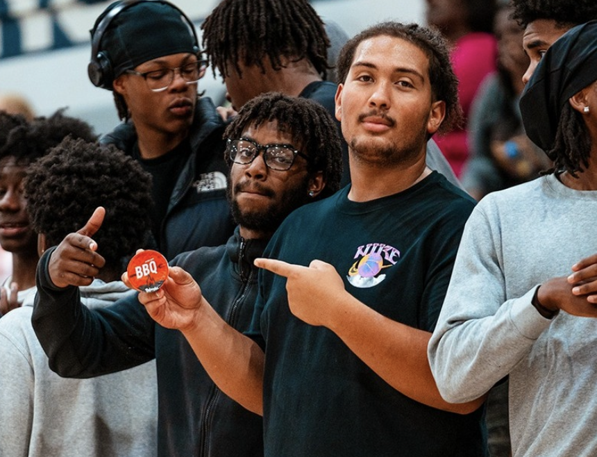 Jaden Smith (left), creator and editor of Millbrook Chronicles, and Marcelo Chitty (right) photographed at a Millbrook High School basketball event
