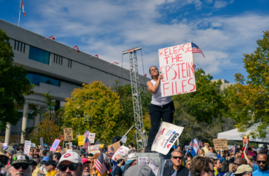 Citizens stage a protest over the justice department’s prolonged holding of the Epstein Files.