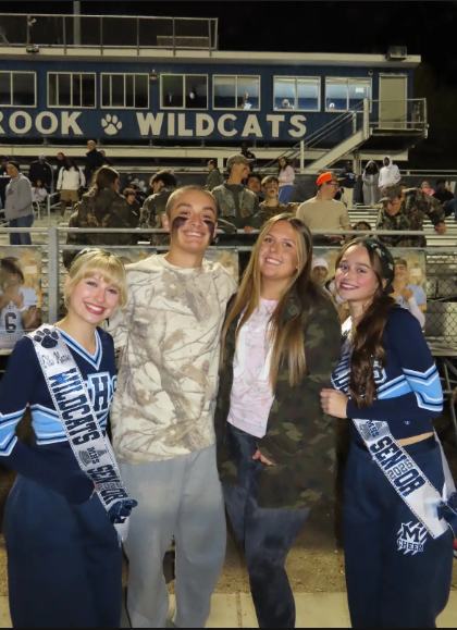 Porter Rummage pictured on the second left stands along with his fellow yearbook classmates.