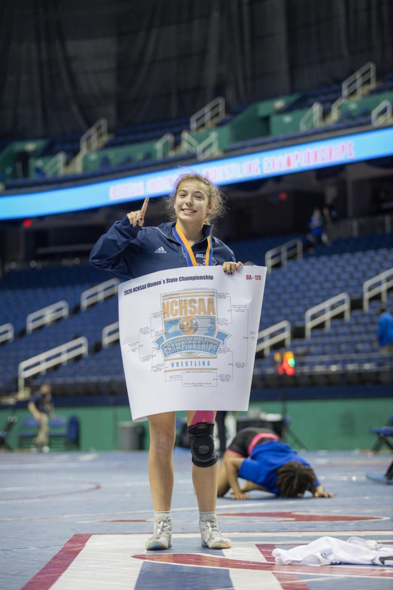 Lisa-Jean Foley faced off against Harley  Hardin from Hoke County High School to win the 8A 120 lbs Wrestling State Championship.
